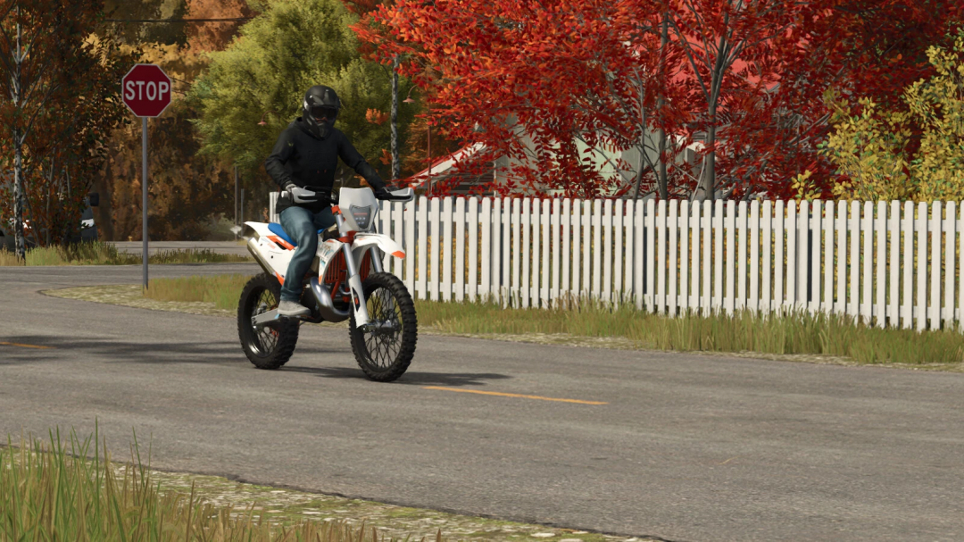Farming Simulator 25 mod: rider on a KTM dirt bike with orange and white color, wearing a black helmet and jacket, motocross style.