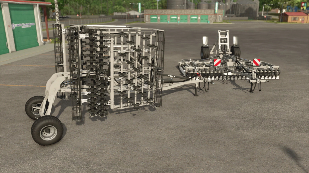 Farming Simulator 25 mod image of the ROL-EX AUCH 600 v1.0.0.0, a large agricultural equipment for cultivating fields.