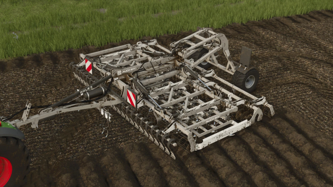 Farming Simulator 25 mods - ROL-EX AUCH 600 v1.0.0.0 cultivator attached to a tractor working the soil.