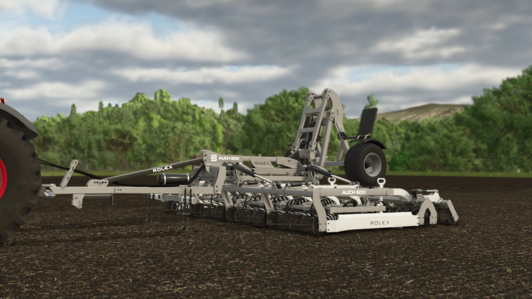 FS25 mod: ROL-EX AUCH 600 seedbed cultivator attached to a tractor on farmland.