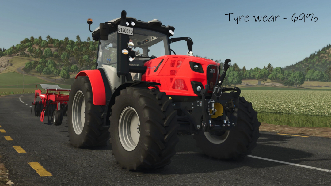 Farming Simulator 25 mod tractor with recently worn tires showing 69% tyre wear, part of the Use Up Your Tyres v1.0.0.0 mod.