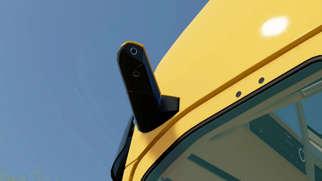 Close-up of a yellow harvester's cabin with a black camera mounted on top in Farming Simulator 22, showcasing a mod for agricultural equipment.