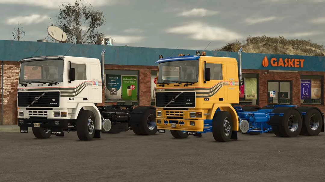 Two Volvo F Series trucks mod from Farming Simulator 25, one white and one yellow, parked in front of a Gasket store, realistic game scene.