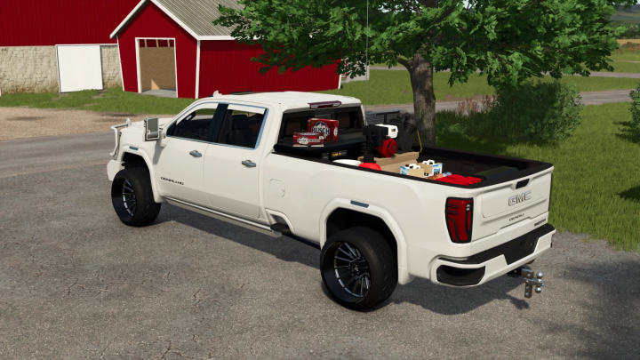 fs25-mods,  White GMC Denali truck with mods loaded in the Farming Simulator 25 game, showcasing rear storage with various tools and equipment.