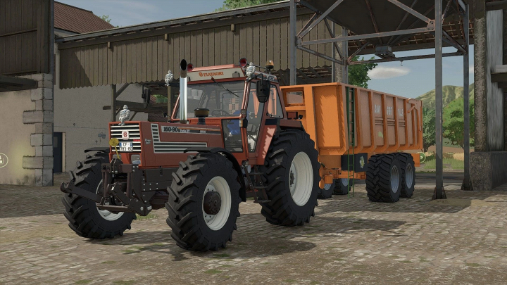 fs25-mods,  Farming Simulator 25 mod - Fiat DT Edit v1.0.0.0 tractor with orange trailer on a farm yard.