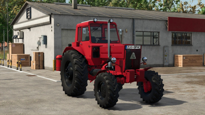 fs25-mods,  Farming Simulator 25 mod: Red MTZ 82 Turbo tractor with detailed wheels and exhaust pipe, standing outdoors near a workshop.