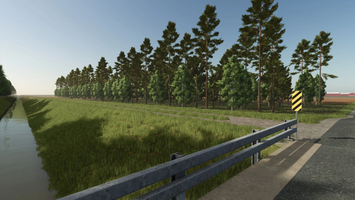 fs25-mods,  Scenic view in Farming Simulator 25 with a field, trees, and a guardrail near a water canal, part of the Prairie Farm Michigan mod v1.2.0.0.