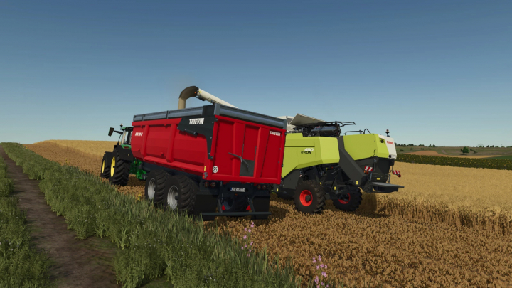 fs25-mods, Farming Simulator 25 mod: Thievin CORTAL 210-72, a large harvesting machine in a wheat field with a green tractor in the background.
