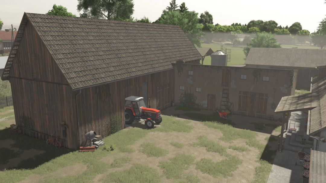 Farm building with barn and cowshed mod in Farming Simulator 25, featuring a tractor and outdoor equipment in a rustic farm setting.