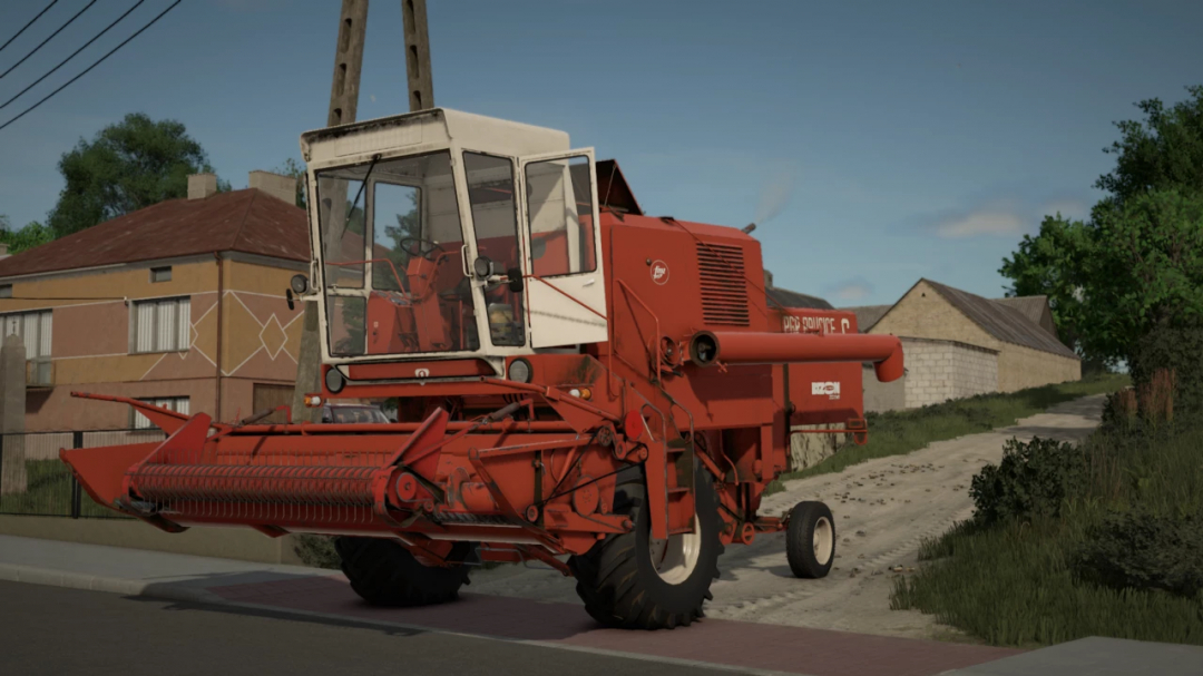 Farming Simulator 25 mod: Red Bizon combine harvester on a rural road, part of FS25 mods collection.