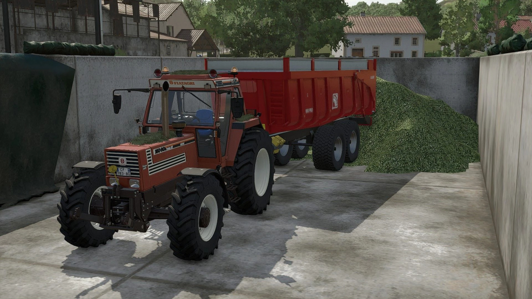 Farming Simulator 25 mod: Fiat DT Edit v1.0.0.0 tractor with red trailer on a farm yard.