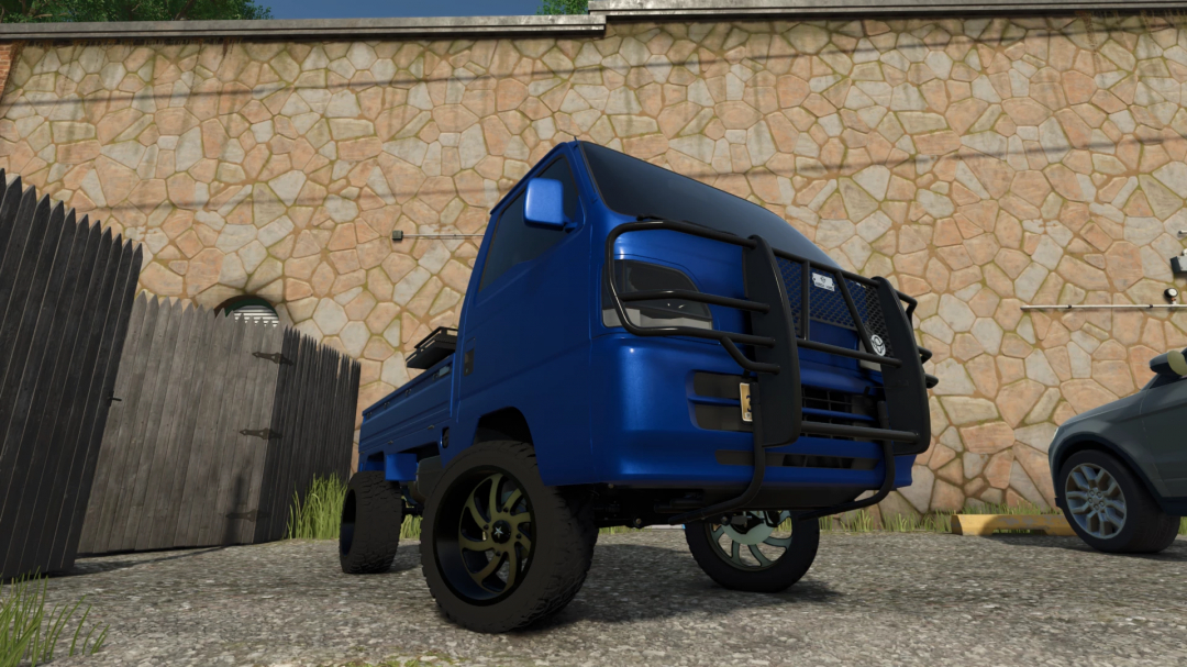 Blue mini truck mod from Farming Simulator 25, part of FS25 mods collection, shown parked outdoors near a wooden fence.