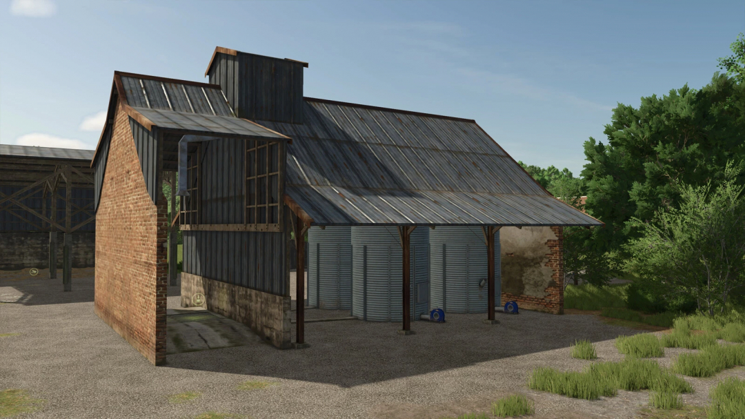 Farm building from Farming Simulator 25 with rusted metal roofing, brick and wooden walls, and storage silos, featuring the Ivoy Cereal mod.