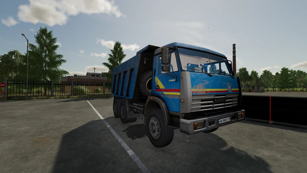 Farming Simulator 22 mod: KamAZ 65115 truck in a parking lot, detailed blue vehicle with a spare tire, suitable for FS22 mods.