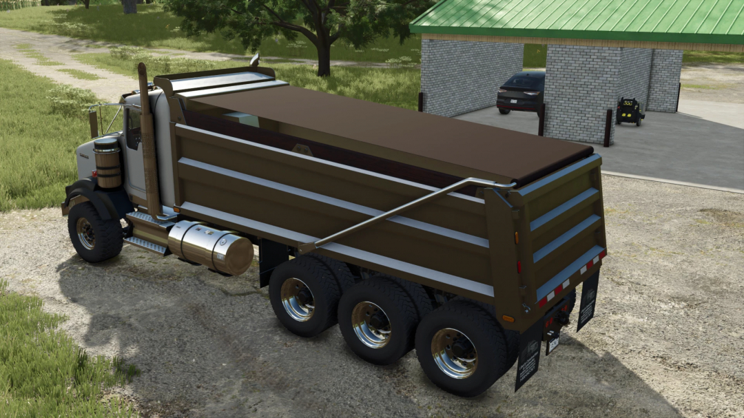 Farming Simulator 25 mod: Kenworth T800 Dumper truck with brown cargo bed parked outdoors on a farm.