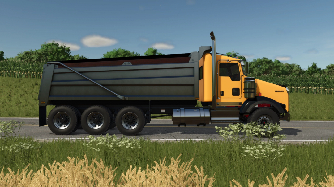 Farming Simulator 25 mod: Kenworth T800 Dumper truck on rural road with green fields and blue sky.
