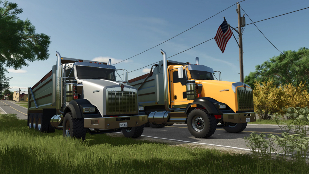 Two Kenworth T800 dump trucks parked on a roadside with American flags and lush greenery, in Farming Simulator 25 mods.