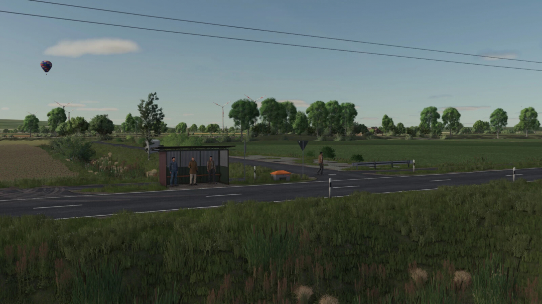 Farming Simulator 25 mod scene with a bus stop at the roadside, surrounded by greenery and wind turbines in the background, showcasing FS25 mods.