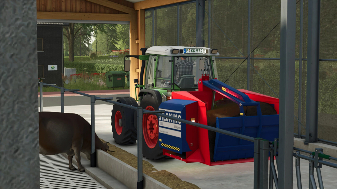 Farming Simulator 25 mod featuring a tractor with a Siloking EA 2300 feed mixer attachment inside a farm building.