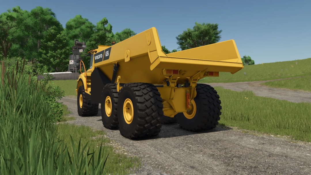 Farming Simulator 25 mods: Yellow Volvo A25G dump truck in a grassy field with trees and a farm structure in the background.