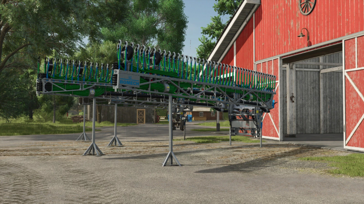 fs25-mods,  FS25 mod Bomech Slurry Distributor Pack with real section control, displayed outside a red barn, ready for farming operations.