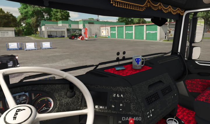 fs25-mods, Inside view of a DAF XF 106 mod in Farming Simulator 25, showing the dashboard, steering wheel, and a coffee mug with 'TEAM' written on it.