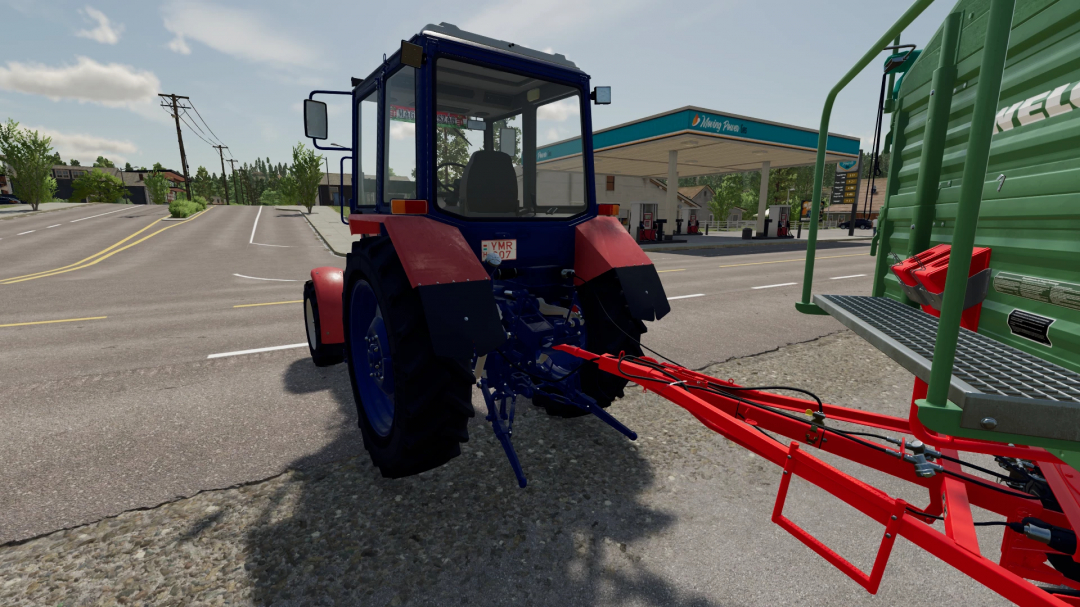 Farming Simulator 22 mod: Belarus Mtz 82.1 Dunantuli tractor near a fueling station, showcasing detailed tractor and mod features.