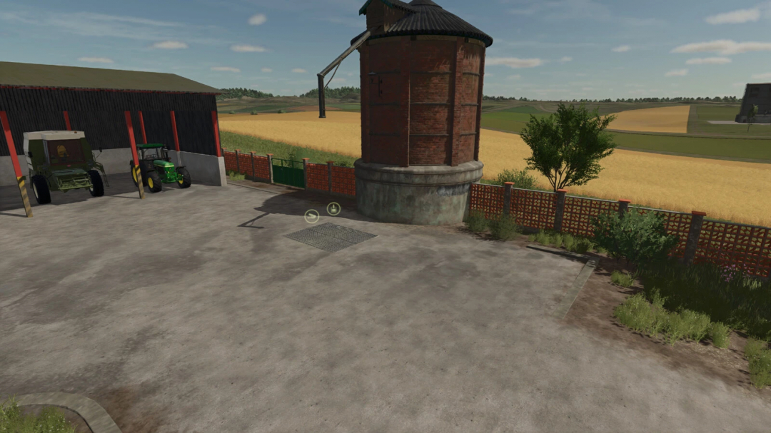 Farming Simulator 25 mod features a brick fence and a metal gate, set beside a red brick water tower in a farming environment.