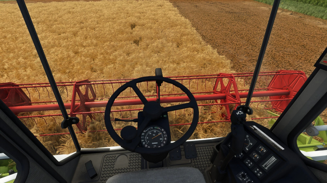 Farming Simulator 25 mod showing the view from inside a combine harvester cockpit with wheat being harvested.