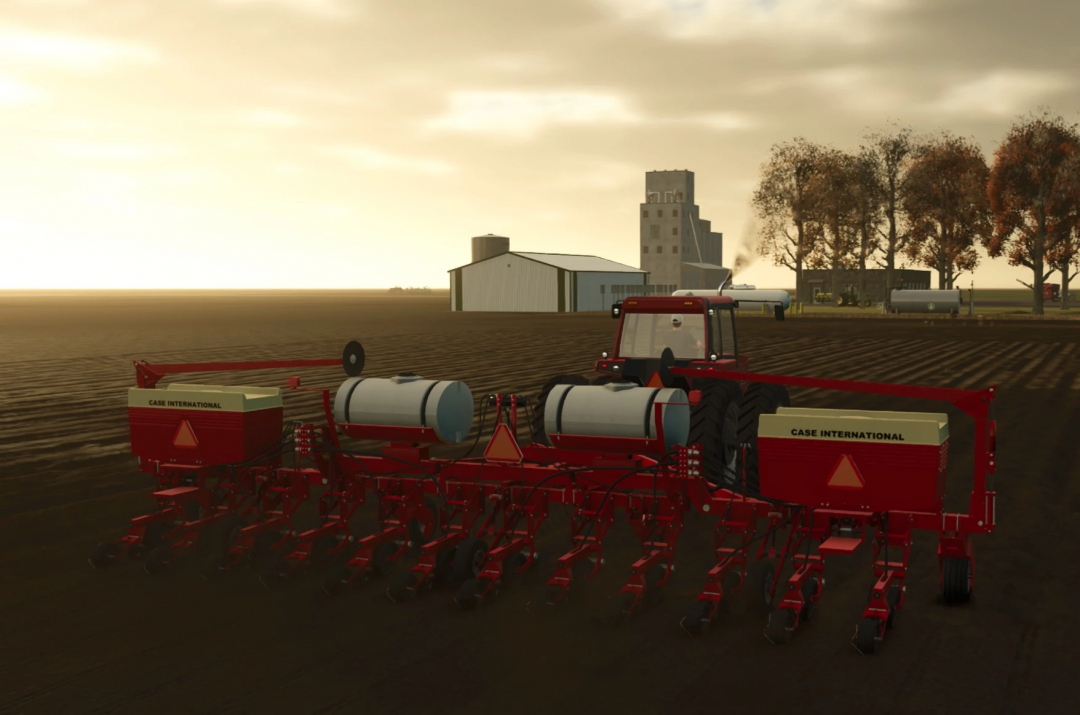Farming Simulator 25 mod: Case IH Cyclo950 planter attached to a tractor on a farm with silos and barns in the background.