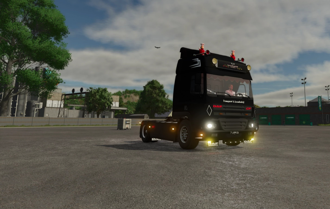Farming Simulator 25 mod featuring a black DAF CF truck with festive decorations, suitable for transport and logistics gameplay.