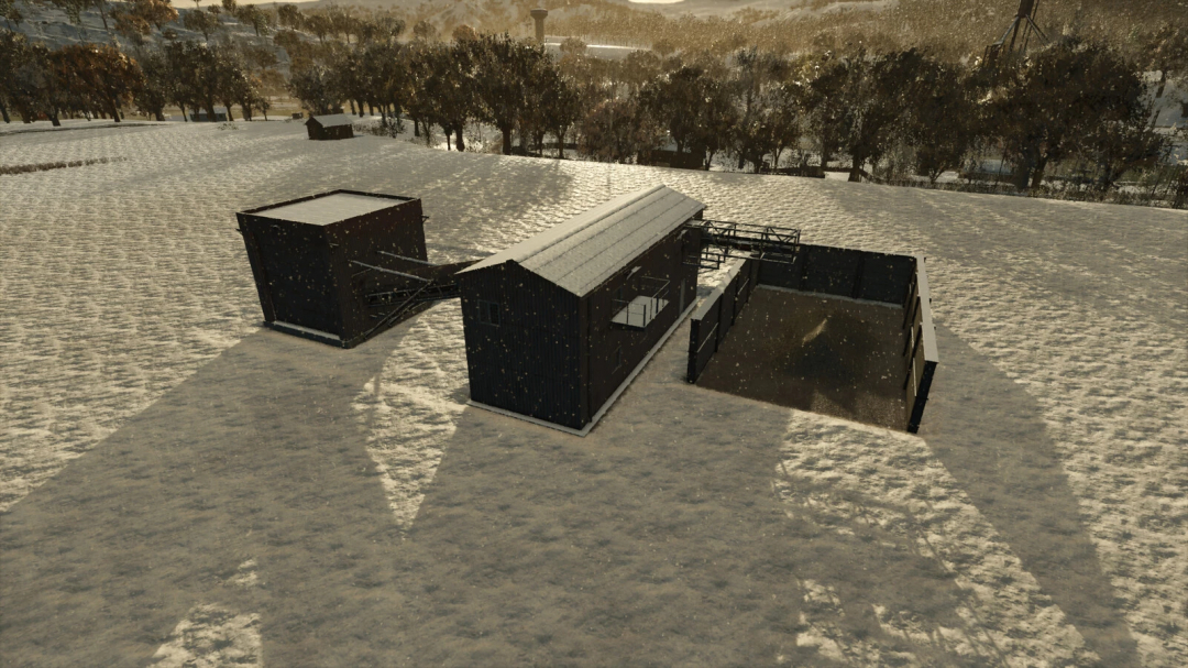Snow-covered debris crusher mod in Farming Simulator 25, with a black metal structure and surrounding snow field.