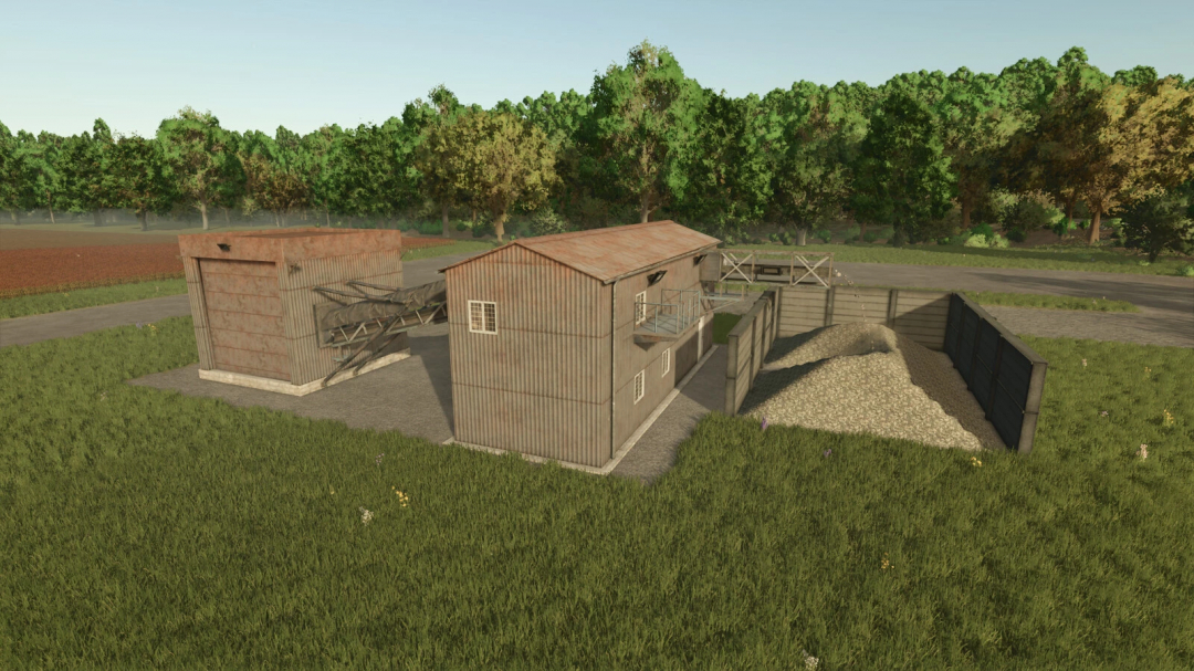Farming Simulator 25 mod image of a debris crusher with metal buildings and gravel storage, part of FS25 mods.