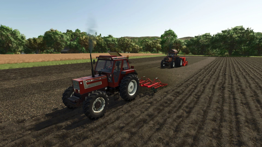 Farming Simulator 25 mod featuring Fiatagri 140-90 tractors performing fieldwork with cultivated land and lush background scenery.