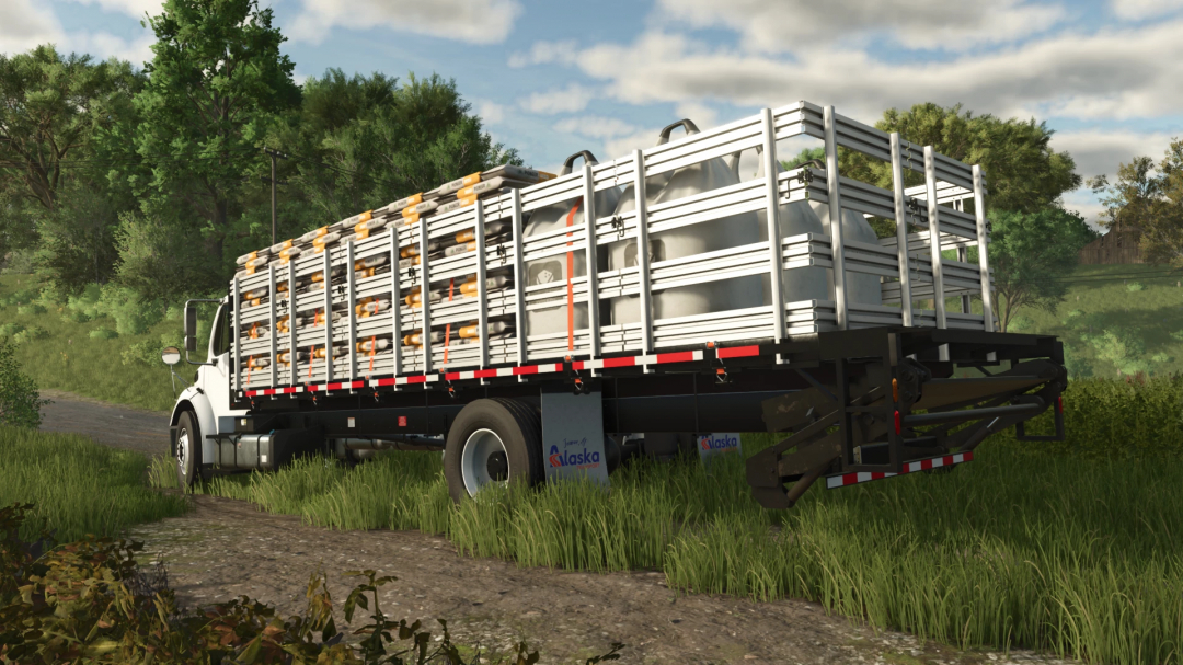 Farming Simulator 25 mod image of a Freightliner M2 Stakebed truck on a grassy field with greenery and trees in the background.