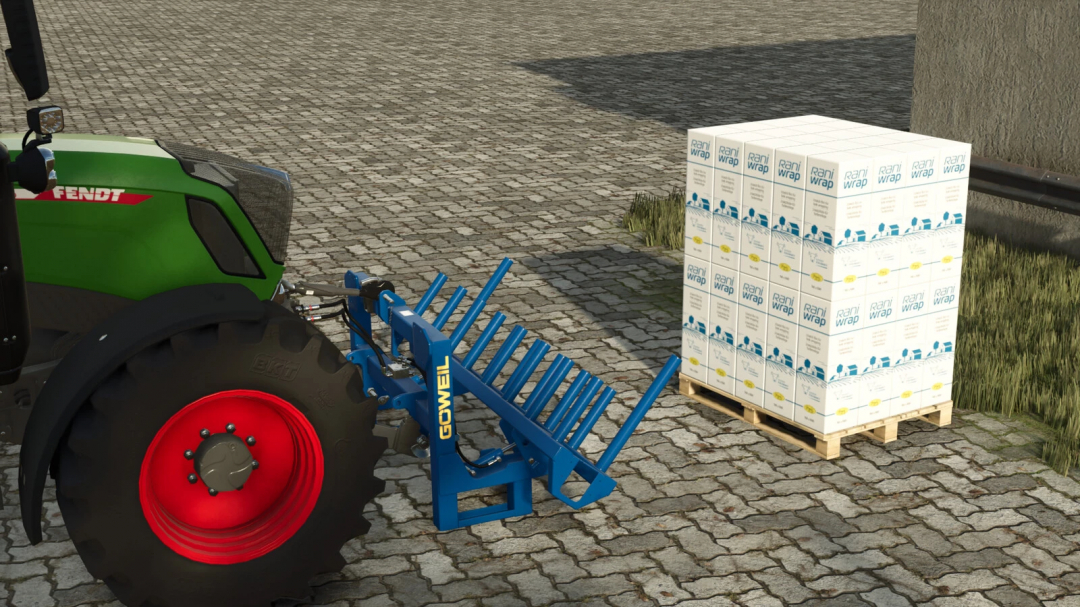 Farming Simulator 25 mod showing a tractor with a blue GOWEL rake attachment and a pallet of Rani Wrap on cobblestone ground.