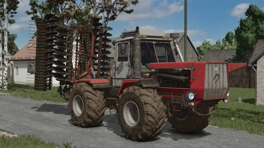 Farming Simulator 25 mod featuring a red HTZ T150K D260 tractor with large tires and a disc harrow attachment, realistic farming equipment.