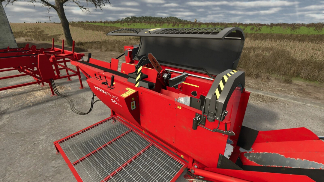 Farming Simulator 25 mods - Red Hakki Pilke 50 Pro wood processor with operator controls on a farm road.