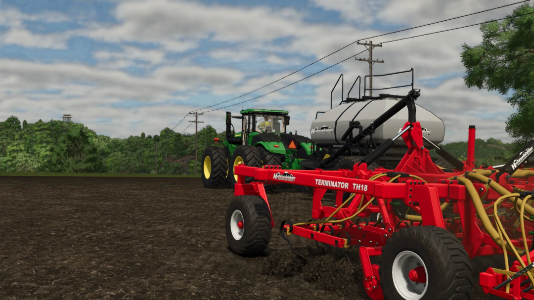 Farming Simulator 25 mod: Green tractor with a red Hatzenbichler Terminator TH18 implement in a field, under a partly cloudy sky