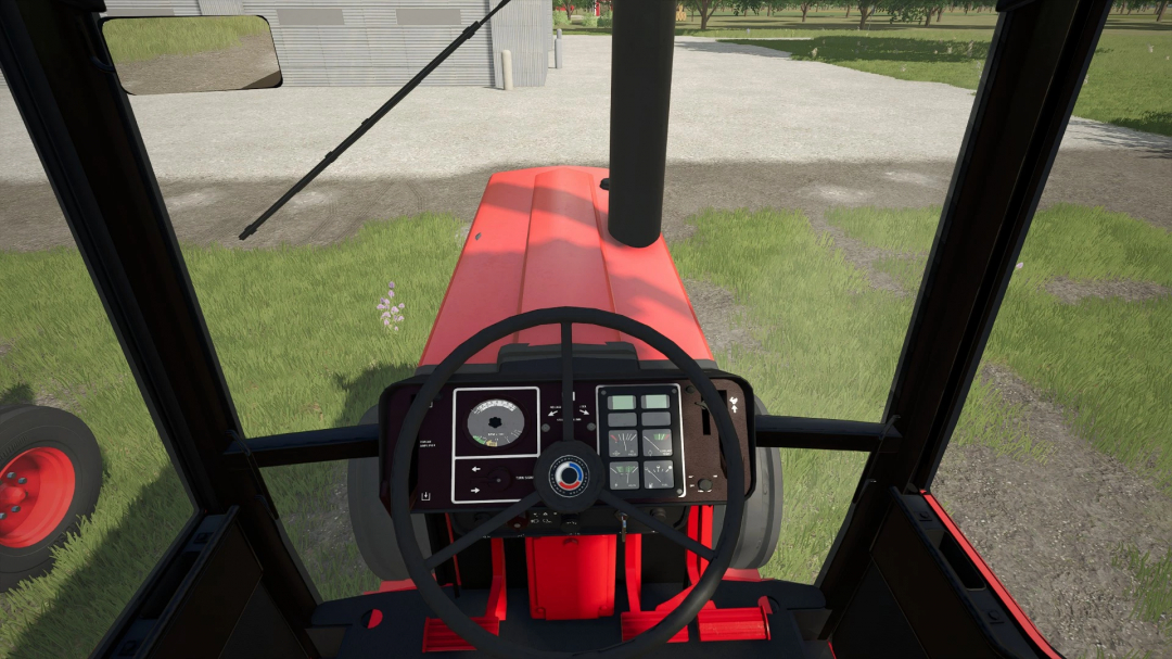 Inside view of a farming tractor cabin in Farming Simulator 25, showcasing the dashboard and steering wheel.