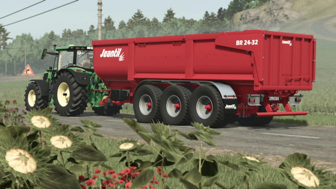 In Farming Simulator 25, a green tractor is pulling a red Jeantil BR 24-32 mod trailer on a rural road.
