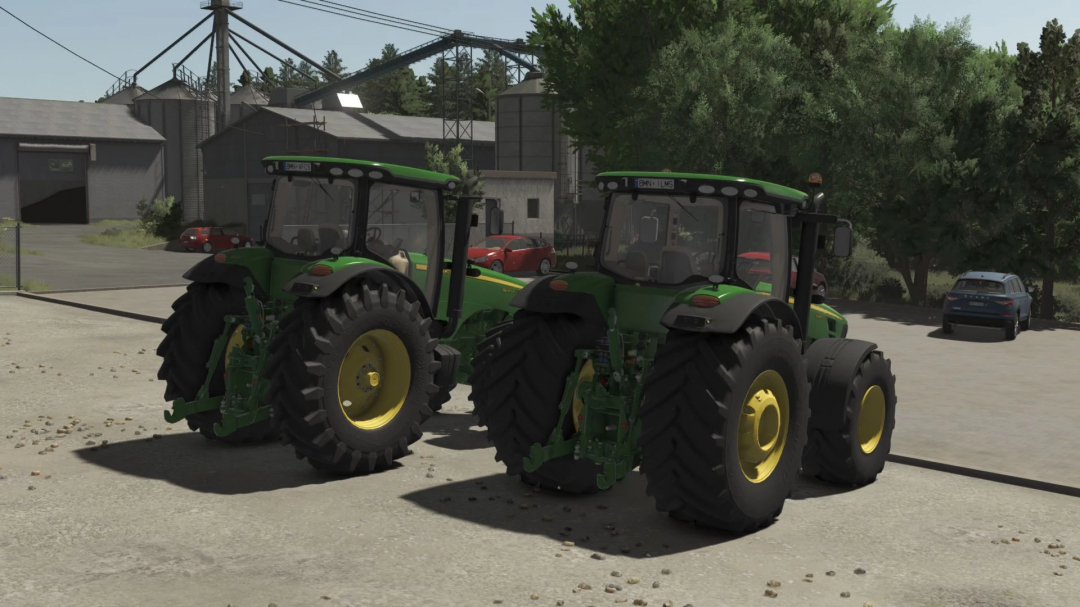 Two John Deere 8R tractors from Farming Simulator 25 mods parked outdoors, showcasing realistic farming equipment.
