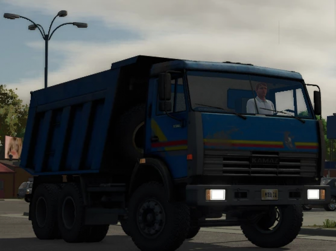 Farming Simulator 25 mod: Blue KamAZ 65115 truck in the game scene, showcasing FS25 mods with realistic vehicle details.