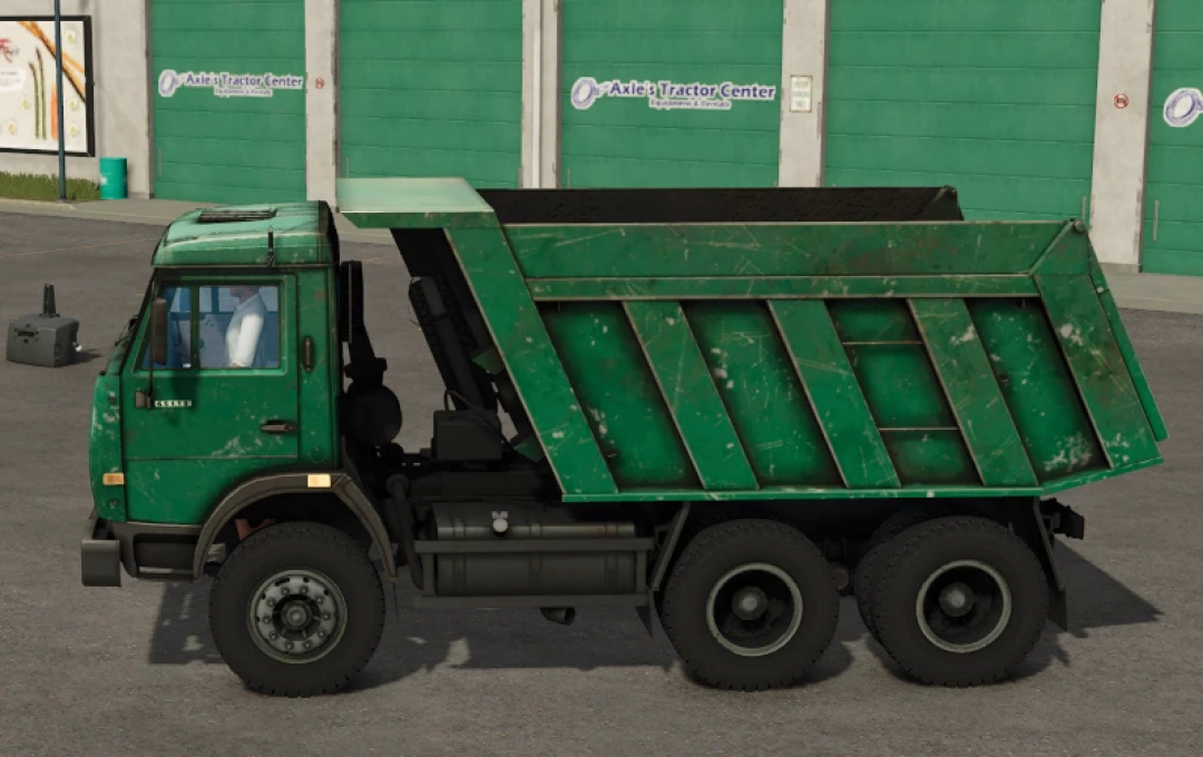 Green KamAZ 65115 dump truck mod from Farming Simulator 25, detailed and slightly weathered.