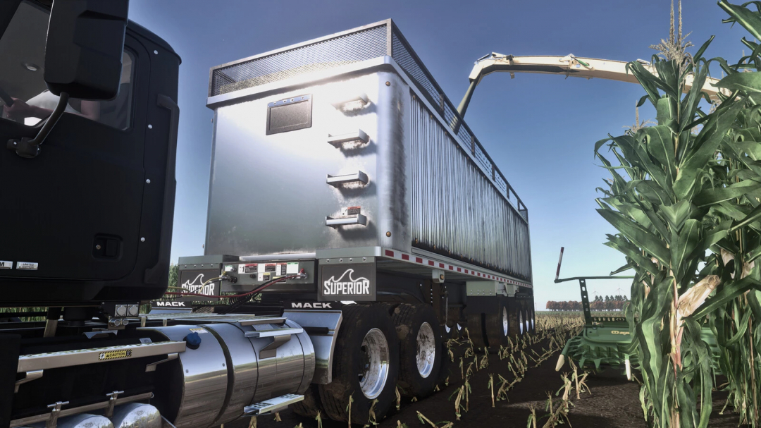 Farming Simulator 25 mod: Lizard Superior End Dump Trailer Pack v1.0.0.0 in a field with corn and farming equipment.