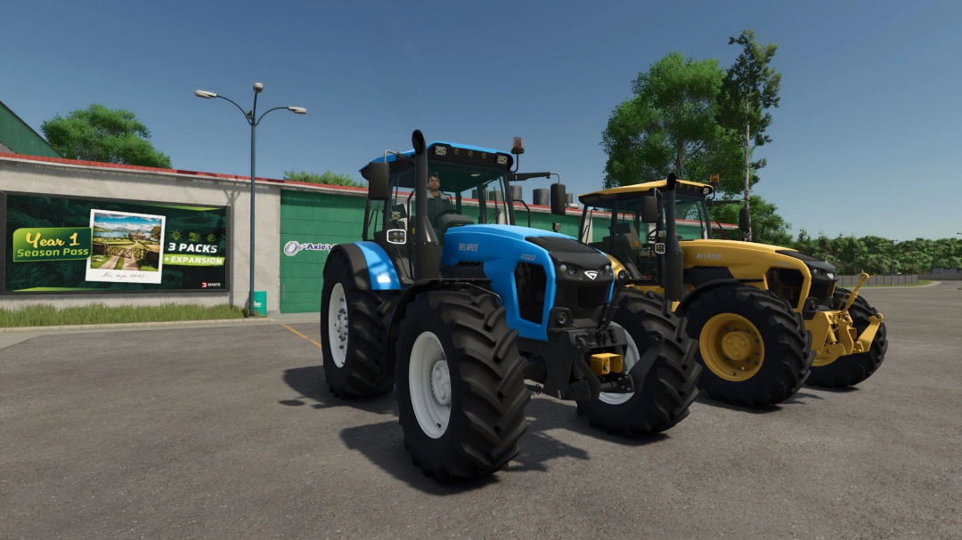 Two Belarus tractors, the blue MTZ 2022 mod and a yellow model, parked outdoors in Farming Simulator 25.