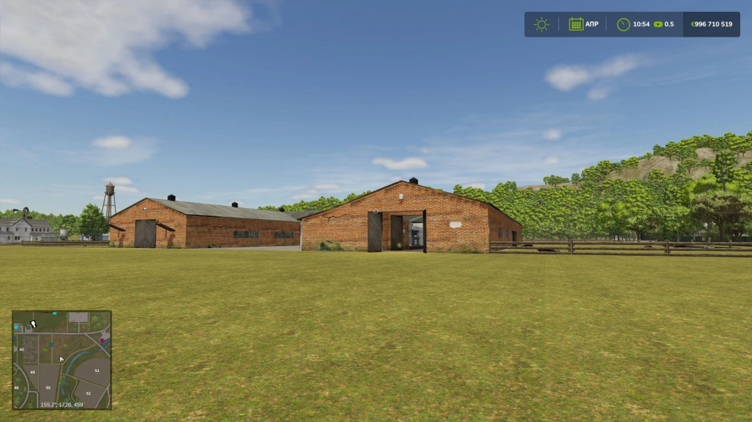 Old barn from FS25 mods in Farming Simulator 25, a brick farm building with open doors and surrounding greenery.