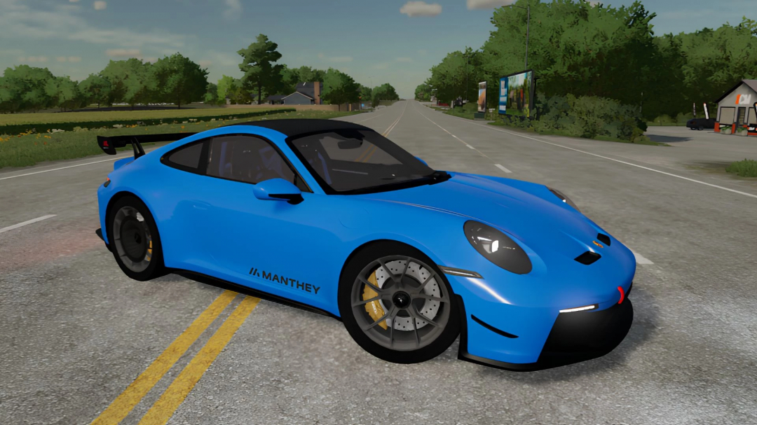 Blue Porsche GT3 in Farming Simulator 22 mod, parked on the road, featuring a sporty design with MANTHEY branding, realistic graphics.