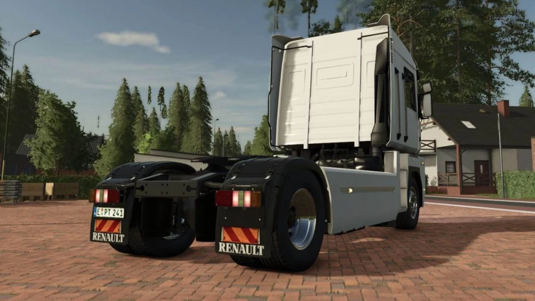 FS25 mod Renault Magnum v1.0.0.0 truck in Farming Simulator 25 on a village street with trees and houses.