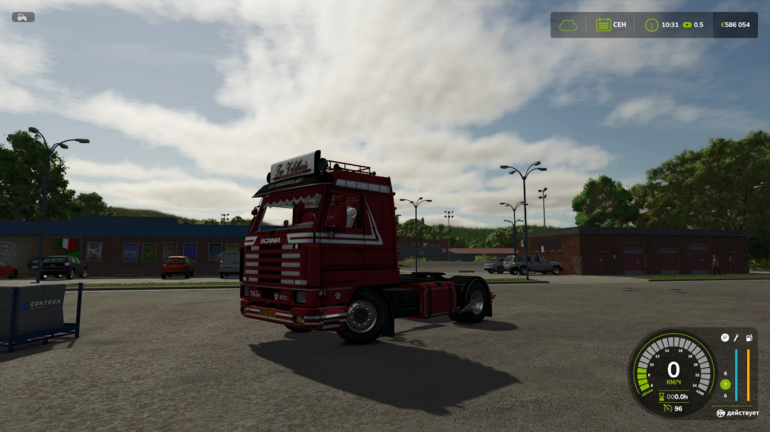 Scania 143m truck mod in Farming Simulator 25, parked in a lot with trees, cars, and a supermarket in the background, realistic graphics.